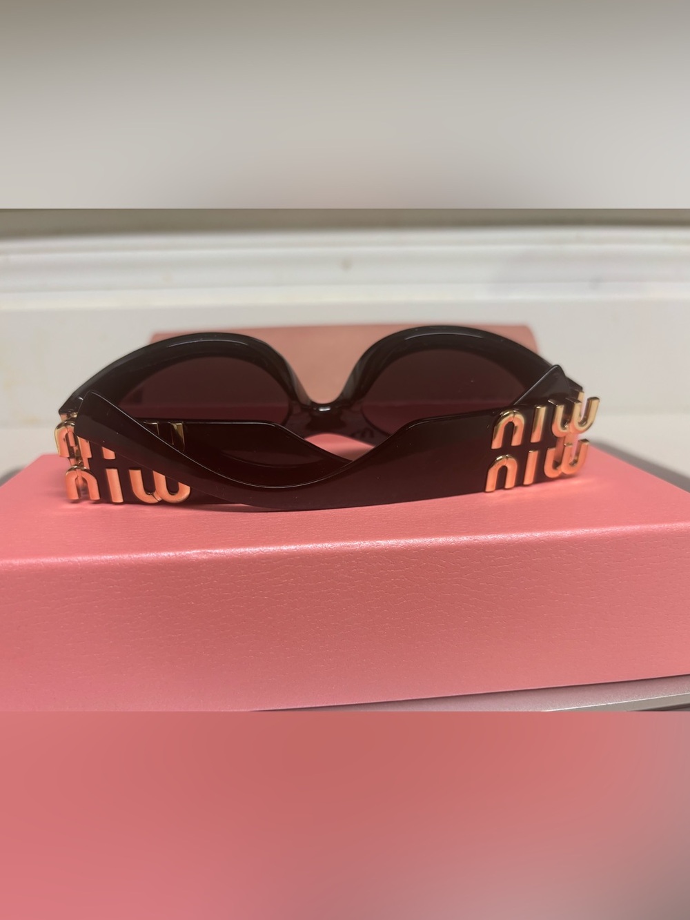 Miu Miu Black Oval Sunglasses with Gold Accent - Picture 5 of 7